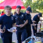 First Responders enjoying hot dogs and burgers.