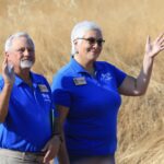 Board members waving at groundbreaking.