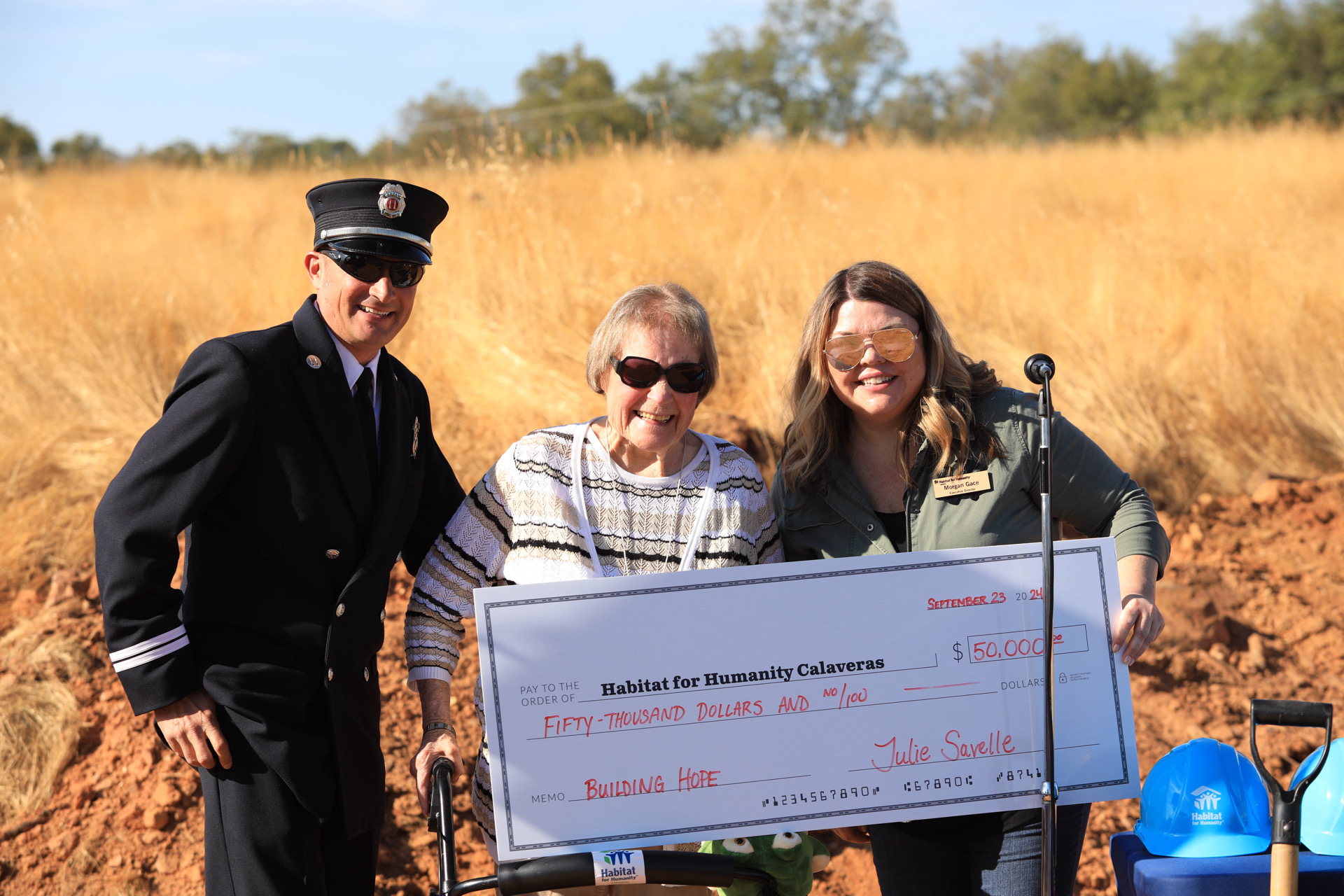 Julie Savelle presents check to Habitat for Humanity Calaveras.