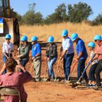 Moving dirt at groundbreaking.