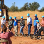 Moving dirt at groundbreaking.