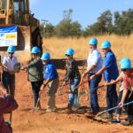 Moving dirt at groundbreaking.