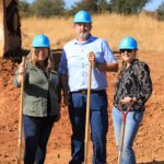 Posing with shovels at groundbreaking.