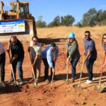 Moving dirt at groundbreaking.