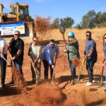 Moving dirt at groundbreaking.