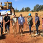 Moving dirt at groundbreaking.