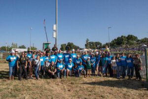 Group photo of the volunteers and supporters before the flag ceremony.