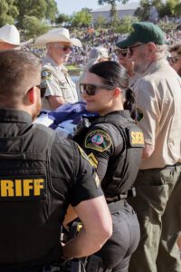 Sheriff's department helping Habitat Calaveras during the flag ceremony.