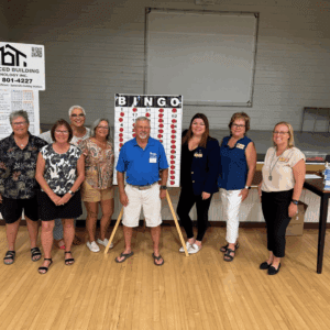 Habitat Calaveras Board of Directors and Staff posing with Bingo Board.