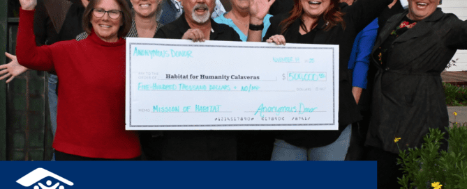 Habitat Calaveras Board and Staff celebrating with giant check from anonymous donation of $500,000, with title "A Season of Giving" with Habitat Calaveras Logo.
