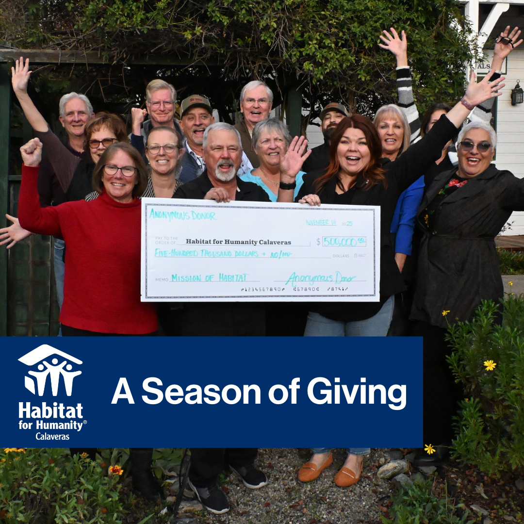 Habitat Calaveras Board and Staff celebrating with giant check from anonymous donation of $500,000, with title "A Season of Giving" with Habitat Calaveras Logo.